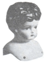 Magazine cutout of a porcelain doll bust.